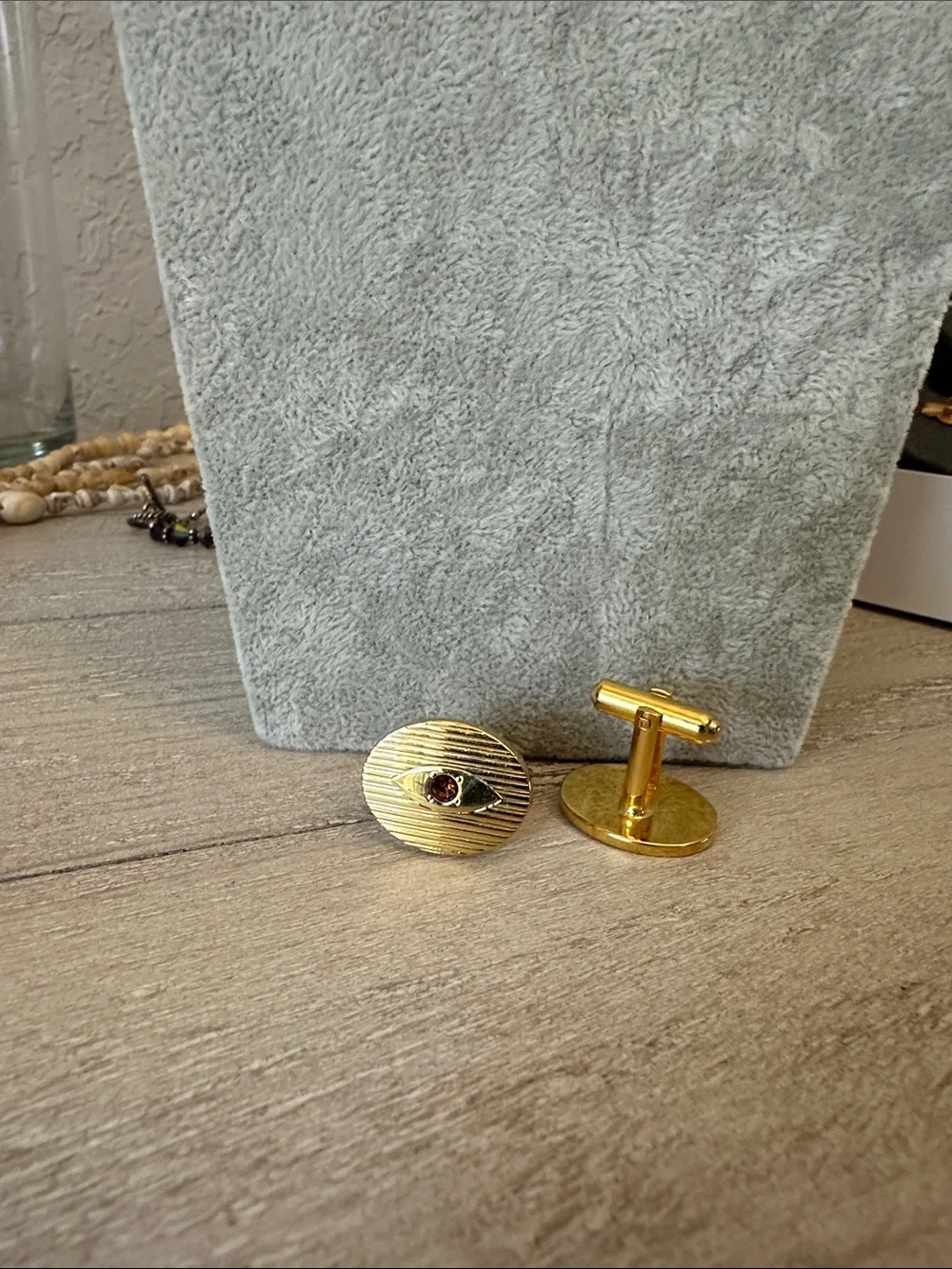 Gold Oval Cufflinks with Garnet Center